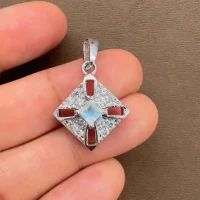 beautifully portraying the rainbow moonstone square shaped silver pendant on hand