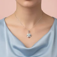 model wearing fancy square shaped blue topaz silver pendant with cubic zirconia