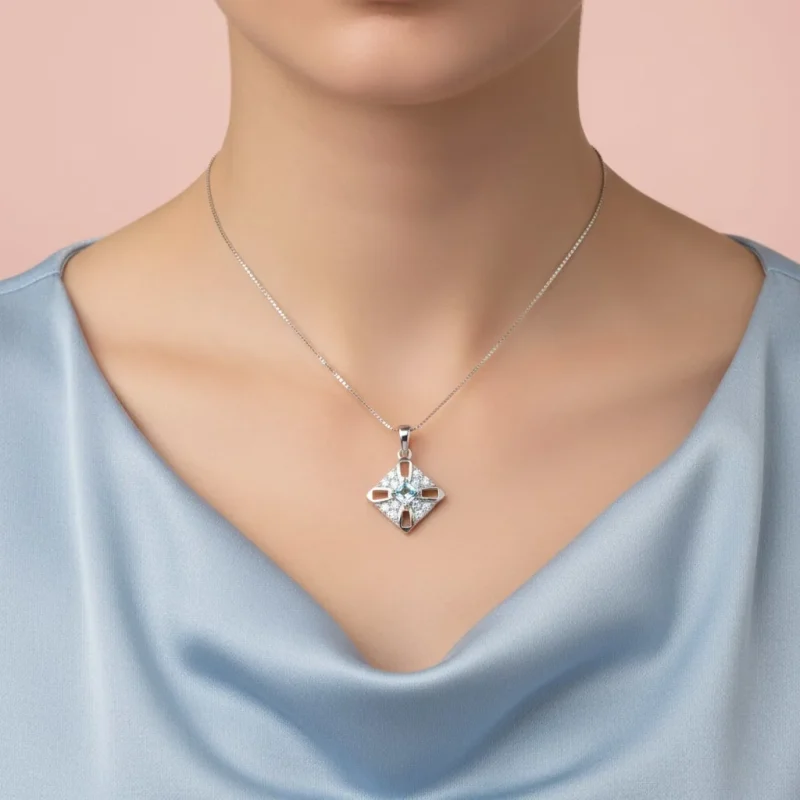model wearing fancy square shaped blue topaz silver pendant with cubic zirconia
