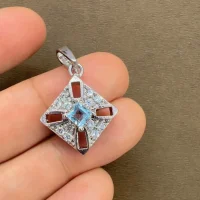 beautifully portraying the blue topaz square shaped silver pendant on hand