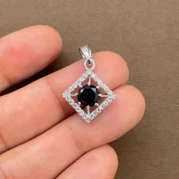 beautifully portraying black onyx and cubic zirconia together creating square shaped silver pendant