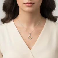 model wearing beautiful square shaped silver pendant with citrine and cubic zirconia