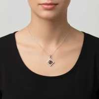 model wearing beautiful square shaped silver pendant with smoky quartz and cubic zirconia