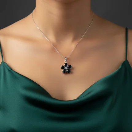 model wearing black onyx silver pendant with cubic zirconia
