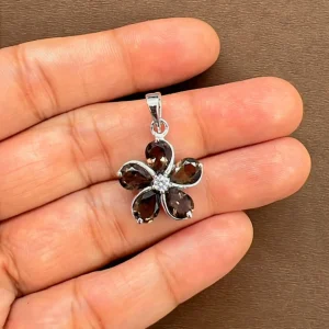 beautifully portraying the smoky quartz silver pendant on hands