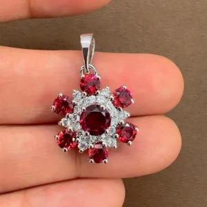 beautifully portraying the garnet silver pendant on hands